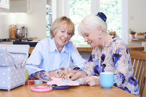 mature women sewing quilting bee